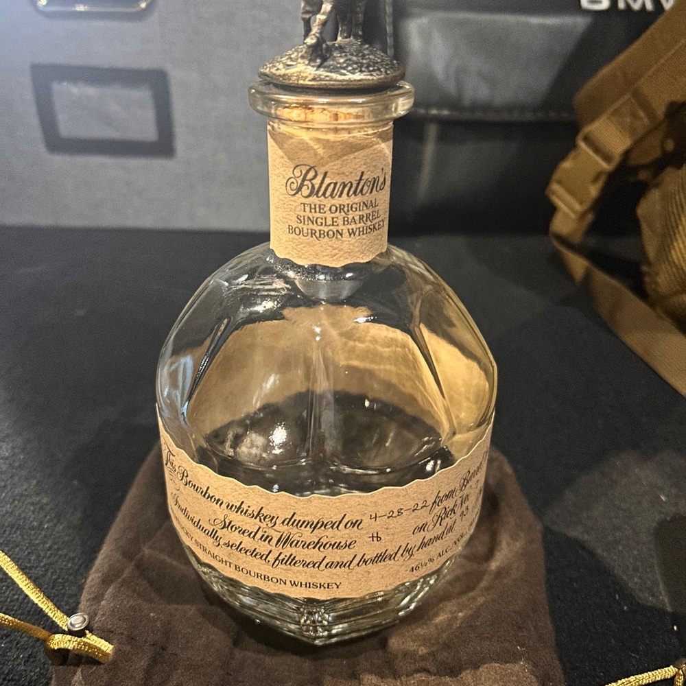 Blanton's empty Original Single Barrel Bourbon bottle (empty) with cork and bag